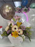 Arreglo floral tipo carterita con gerberas