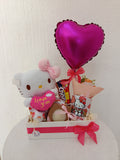 Arreglo Hello Kitty con taza y chocolates
